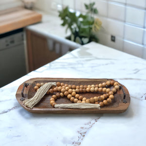 Farmhouse bead garland styled in decorative bowl