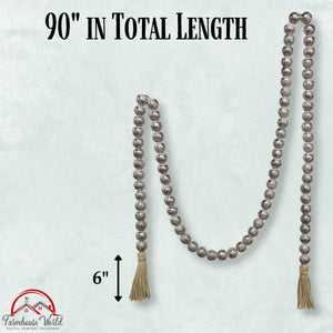 Decorative string of beads with tassels on a light gray background, labeled '90" in total length' and '6"'. Farmhouse World logo visible.