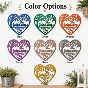 Color options chart showing heart-shaped personalized metal wall art in multiple colors: blue, green, orange, purple, rose gold, stone, and yellow. Each heart has laser-cut tree branches and the text 'The Johnsons 05.