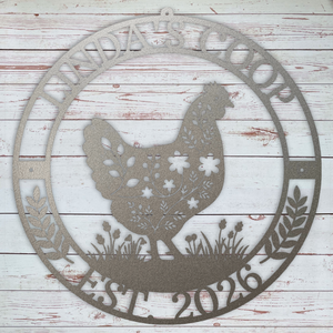 Decorative metal sign with a rooster silhouette and text on a wooden background