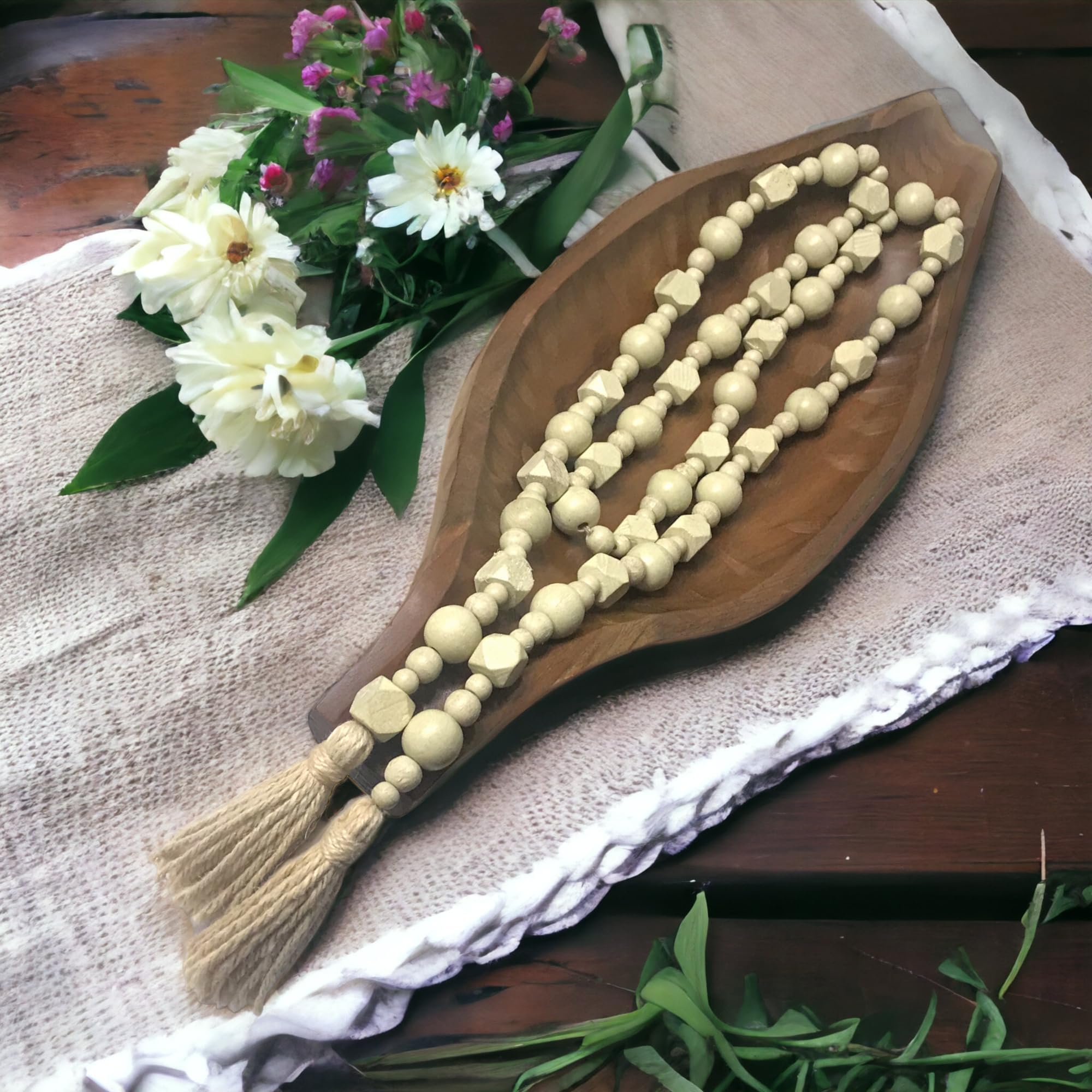 Wood bead garland with jute tassels for mantel decor