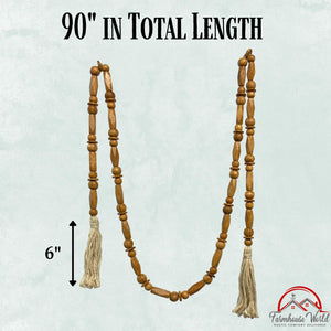 Wood bead garland styled with vase and farmhouse accents