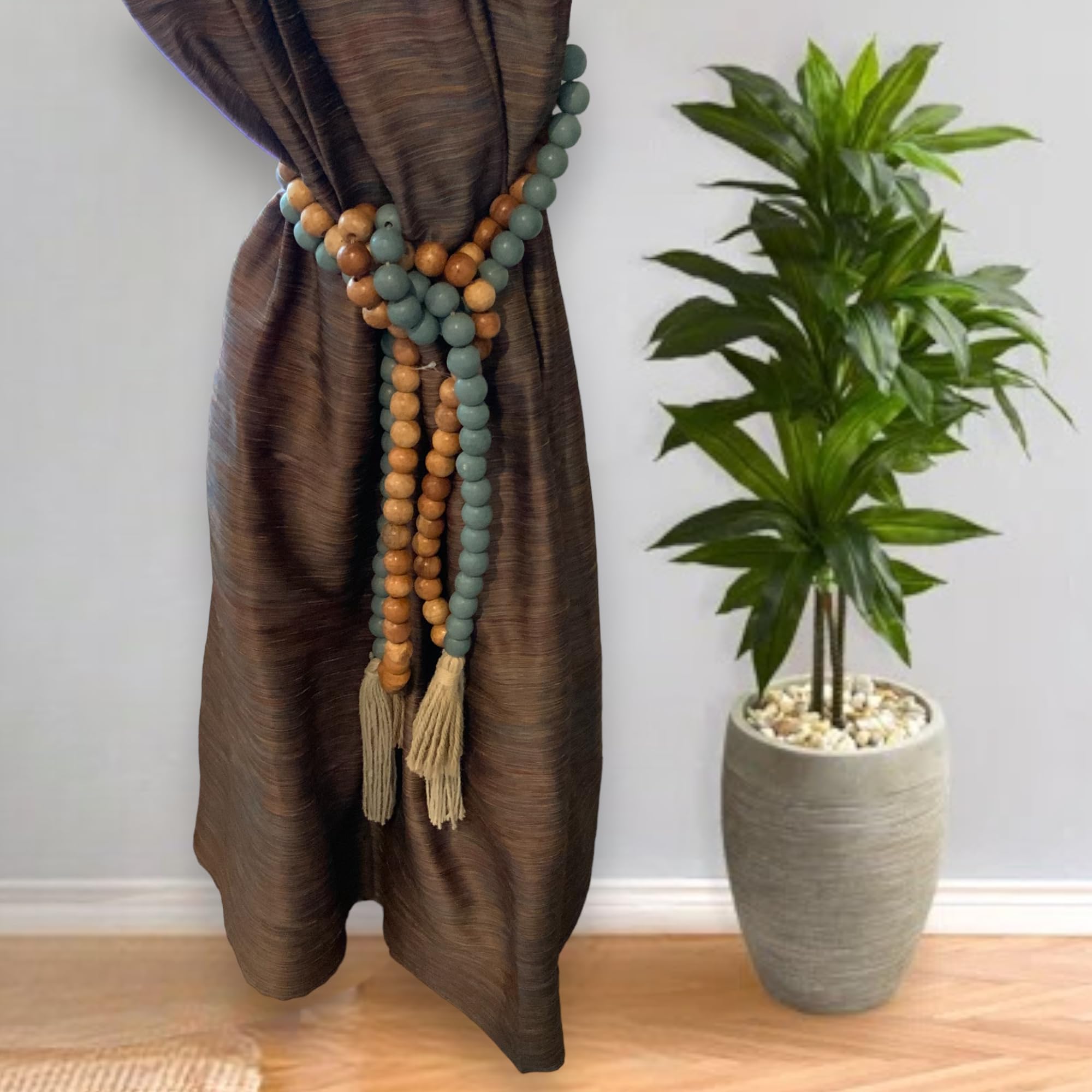 Wooden bead garland used as curtain tieback