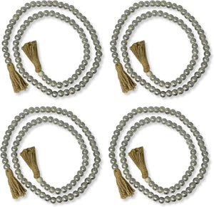 Four sets of gray beaded necklaces with tassels on a white background