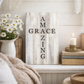Decorative sign with 'AMAZING GRACE' text in a home setting with flowers and candles.