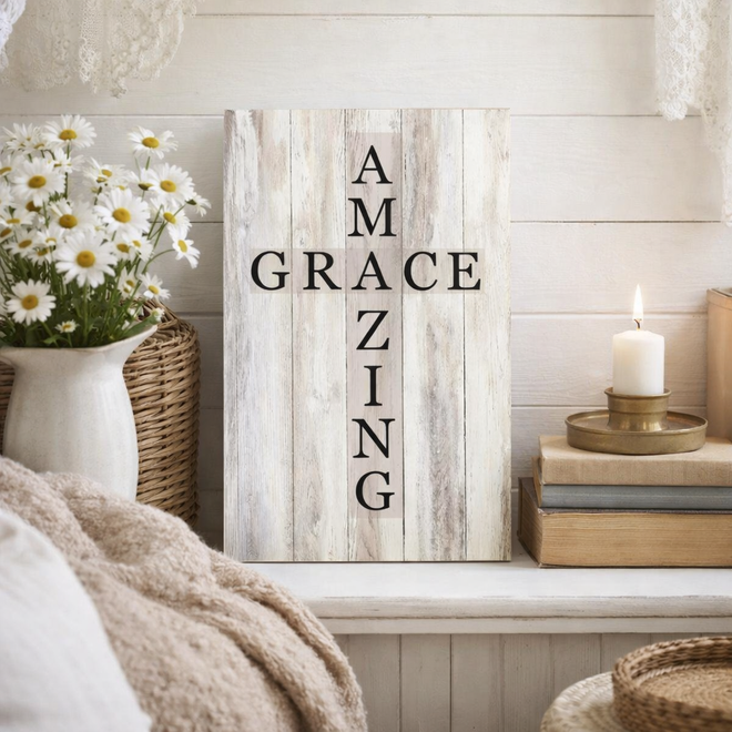 Decorative sign with 'AMAZING GRACE' text in a home setting with flowers and candles.