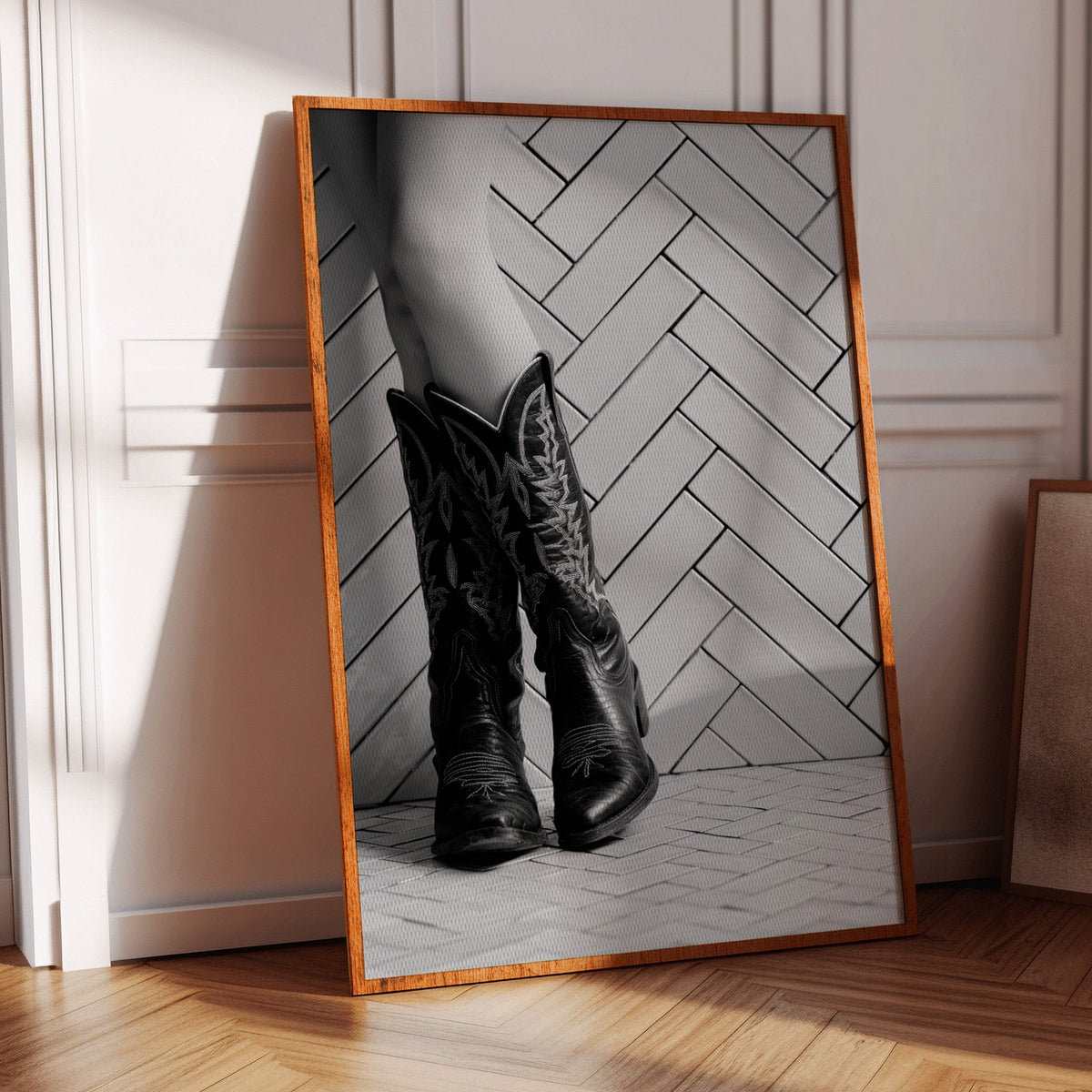 Black and white cowboy boots wall art displayed in a modern Western room