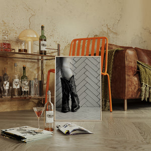 Modern Western cowboy boot wall art displayed in a loft
