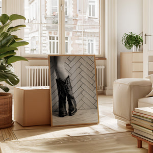 Cowboy boots artwork displayed in a modern Western living room