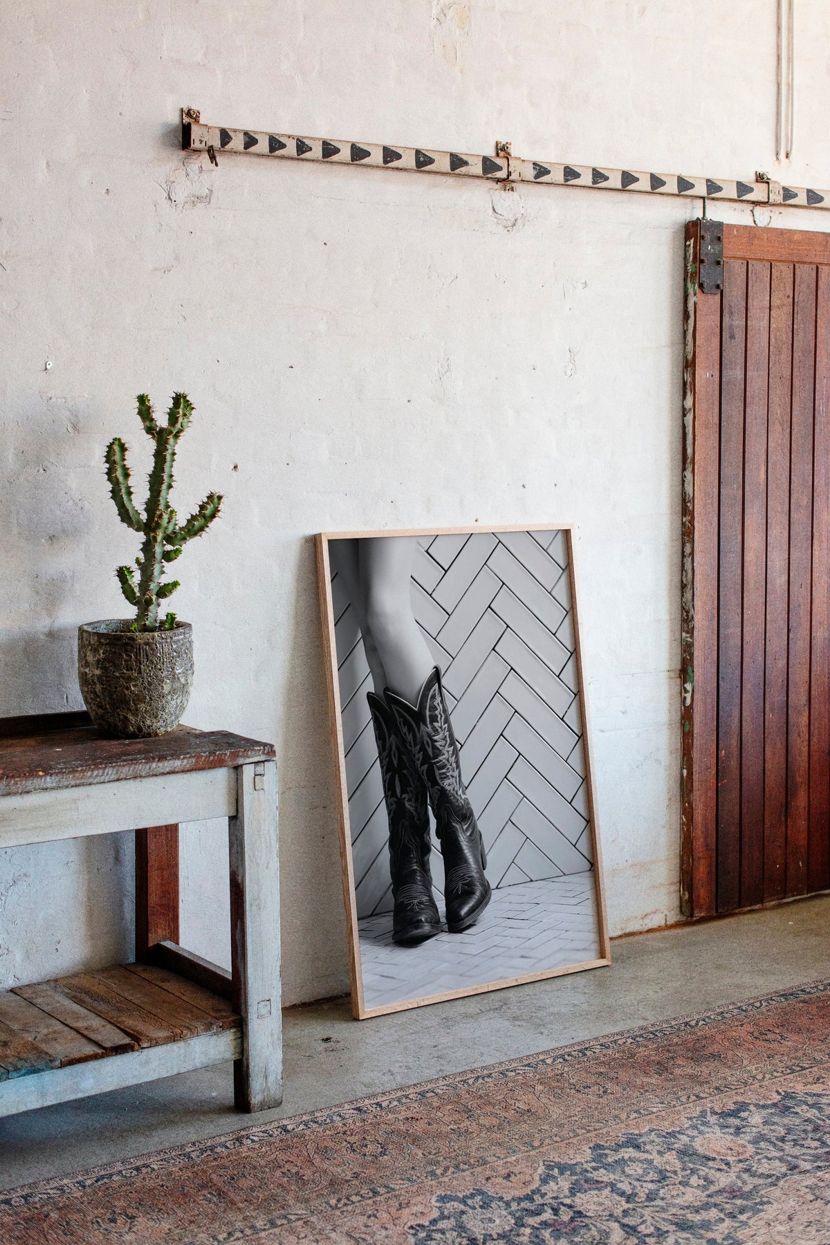 Cowboy boots wall art styled in a contemporary Western interior