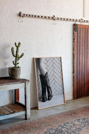 Cowboy boots wall art styled in a contemporary Western interior