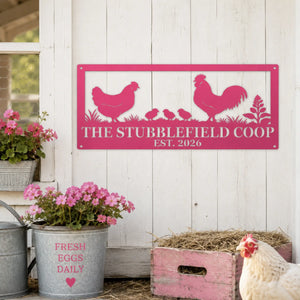 A rectangular metal chicken coop sign with a hot pink border and silhouette design of a hen, rooster, chicks, and plants. The sign reads 'THE STUBBLEFIELD COOP EST.
