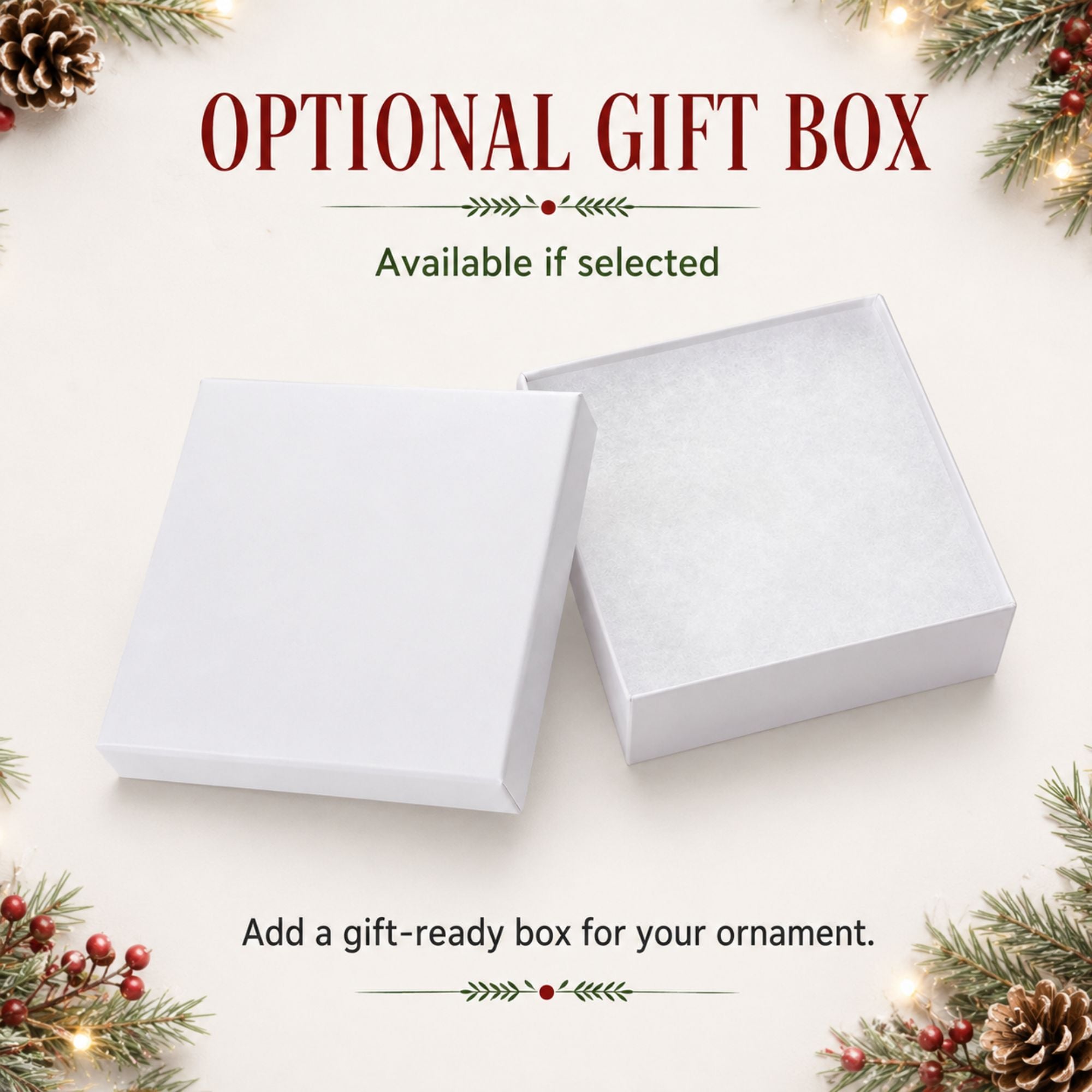 Two plain white square gift boxes shown on a light cream background with holiday decorations around the edges and text reading 'OPTIONAL GIFT BOX' and 'Add a gift-ready box for your ornament.'.