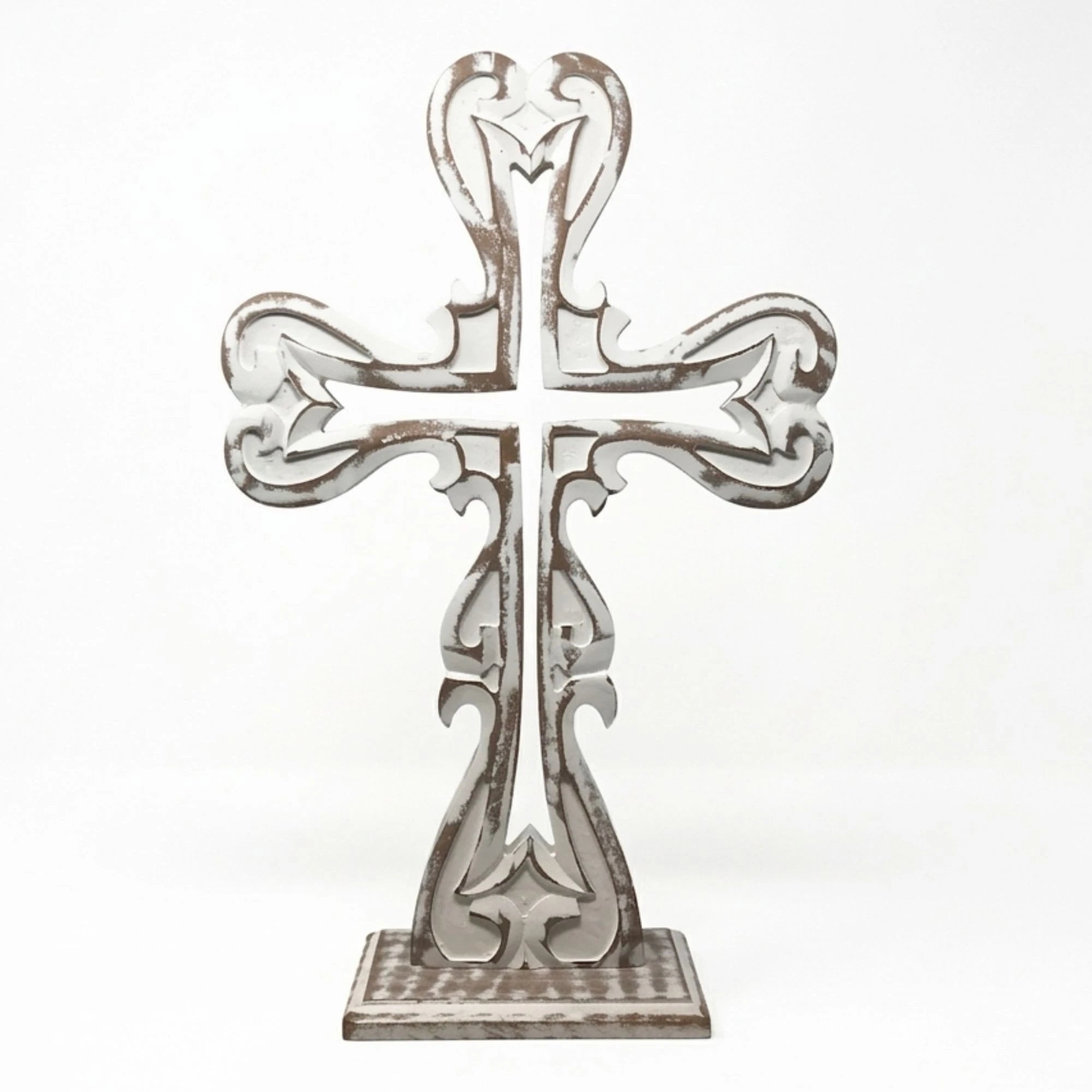 Farmhouse cross styled on mantel creating a warm and peaceful space