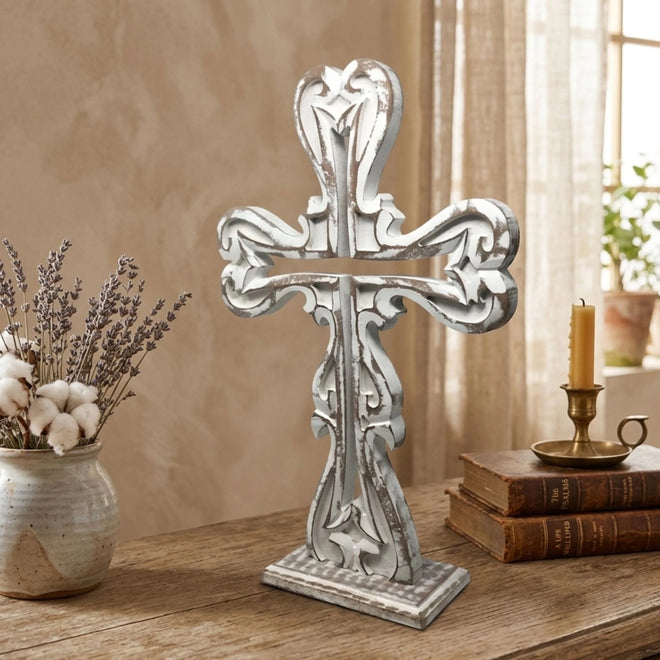 Hand-carved wood cross featuring detailed double-sided design