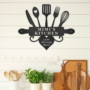 Decorative wall art with kitchen utensils and 'MIMI'S KITCHEN' text on a wooden wall.
