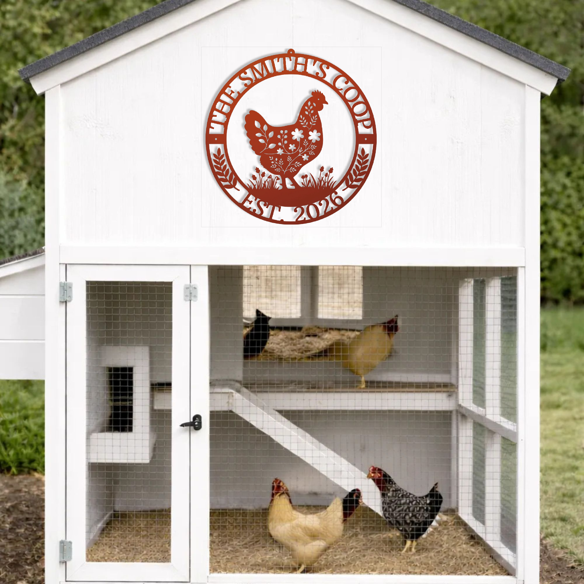 White chicken coop with a red logo on the door, featuring three chickens inside.