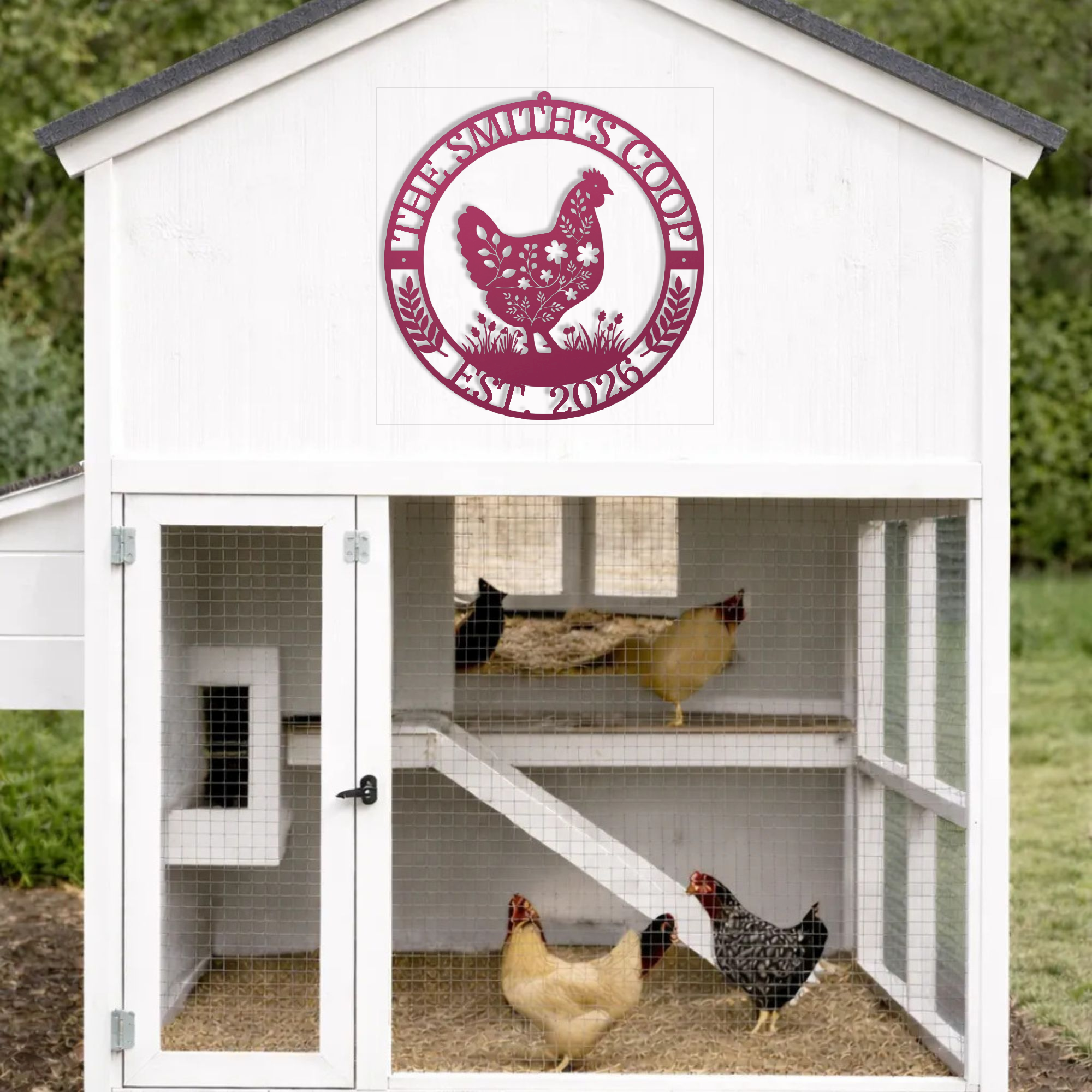 White chicken coop with a pink sign featuring a chicken and text, with chickens inside.