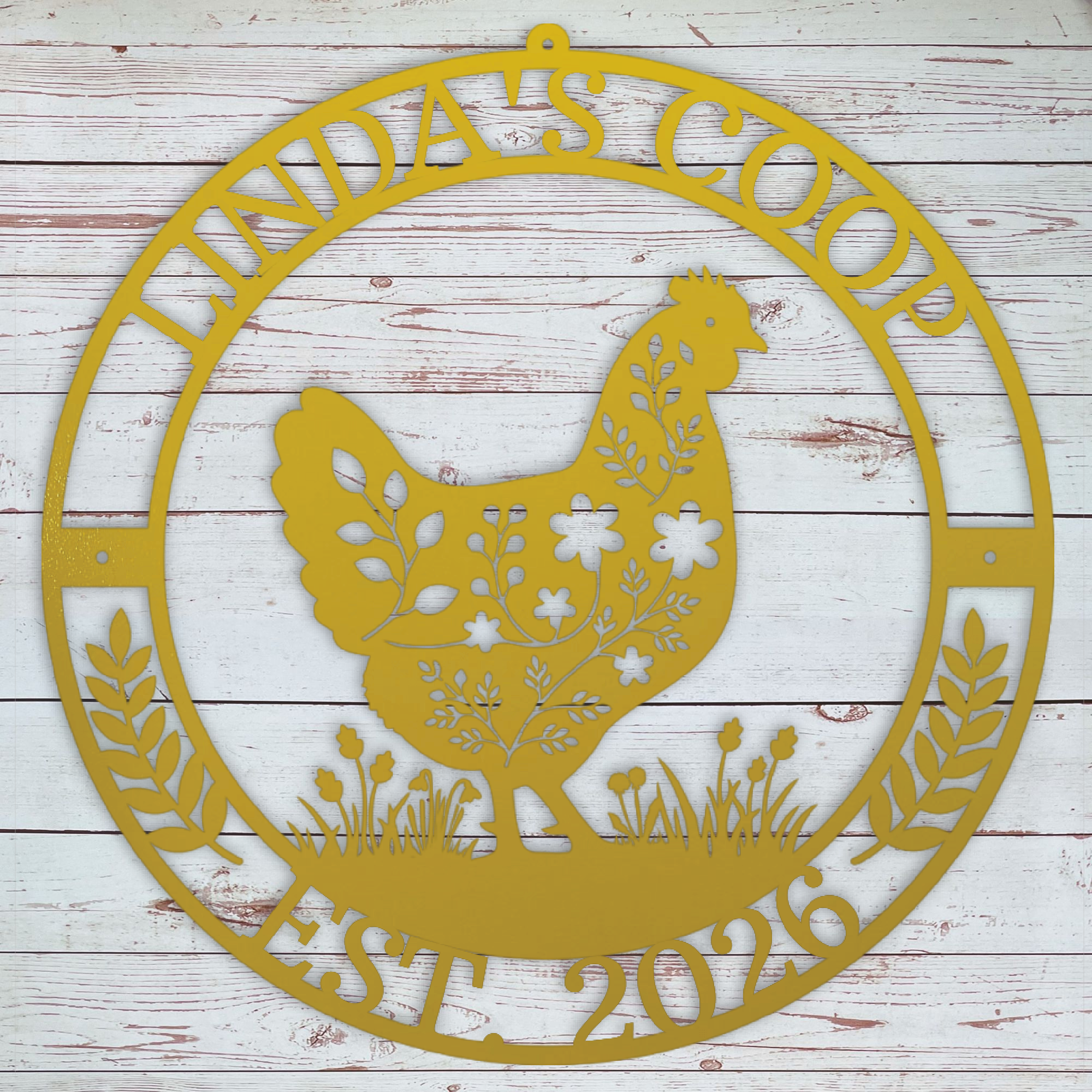 Decorative metal sign with chicken silhouette and text on a wooden background