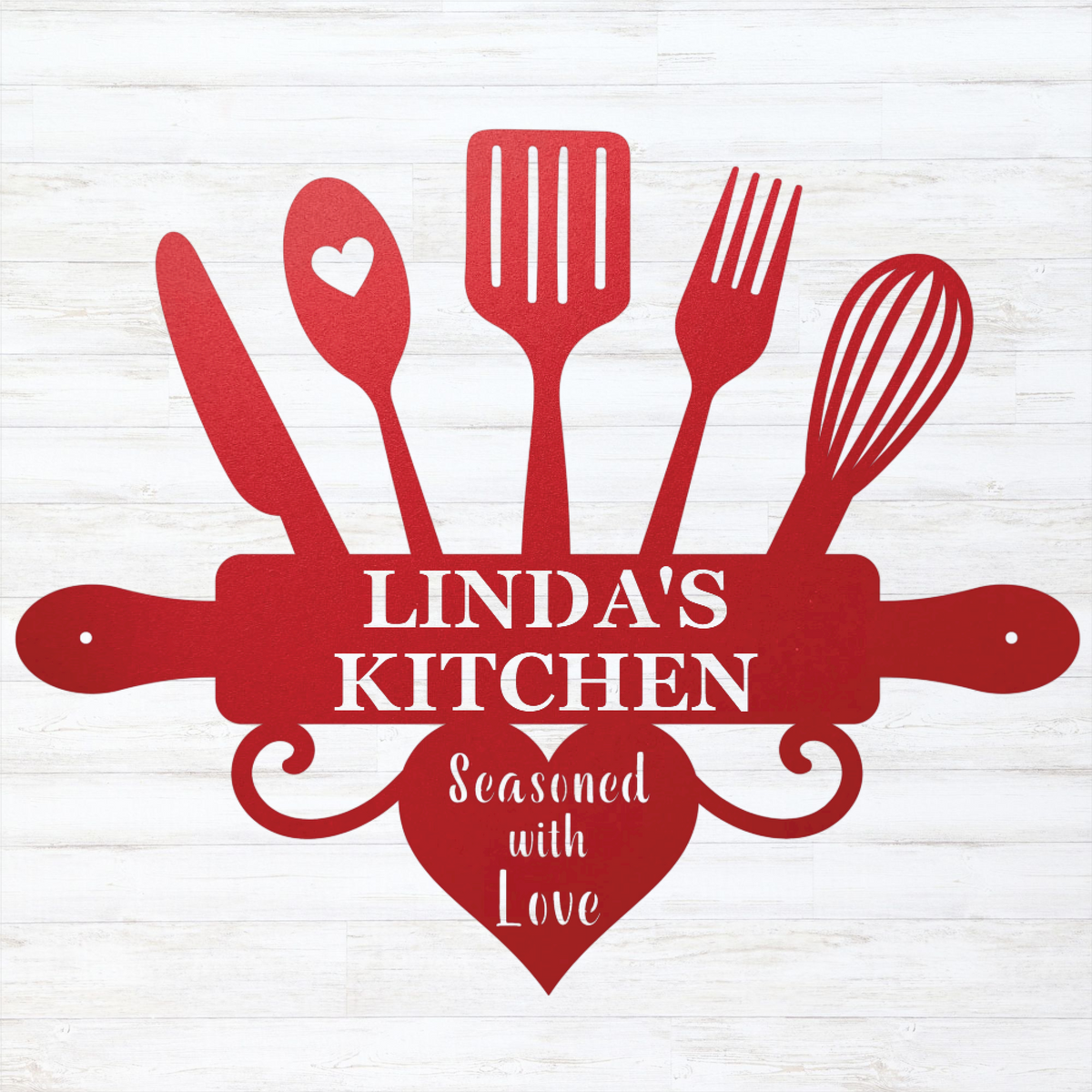 A red kitchen-themed decorative sign or cutout featuring utensil silhouettes, a rolling pin, a heart, and the text 'LINDA'S KITCHEN' with 'Seasoned with Love' below, shown on a white wood-plank background.