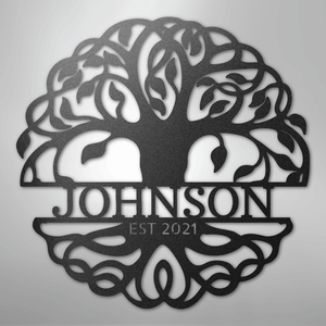 Decorative metal wall art with tree design on a gray background