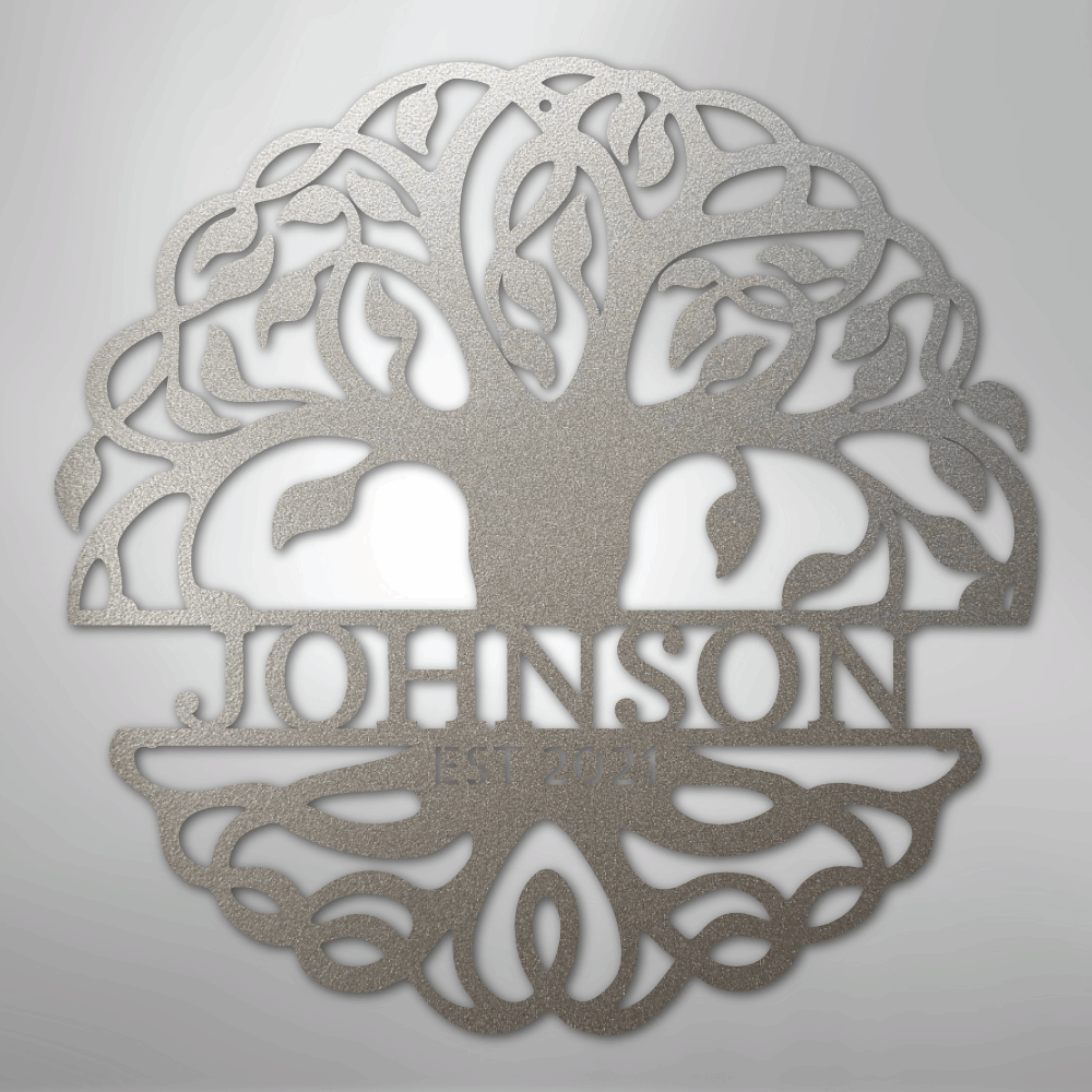 Decorative metal wall art with 'Johnson' engraved inside a tree design on a light gray background.