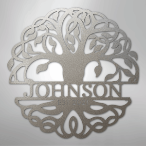 Decorative metal wall art with 'Johnson' engraved inside a tree design on a light gray background.