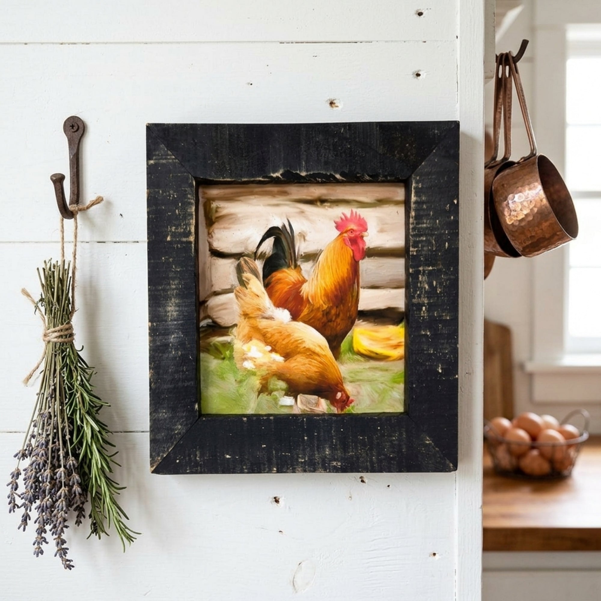 Framed picture of chickens on a white wall with herbs and copper pots.