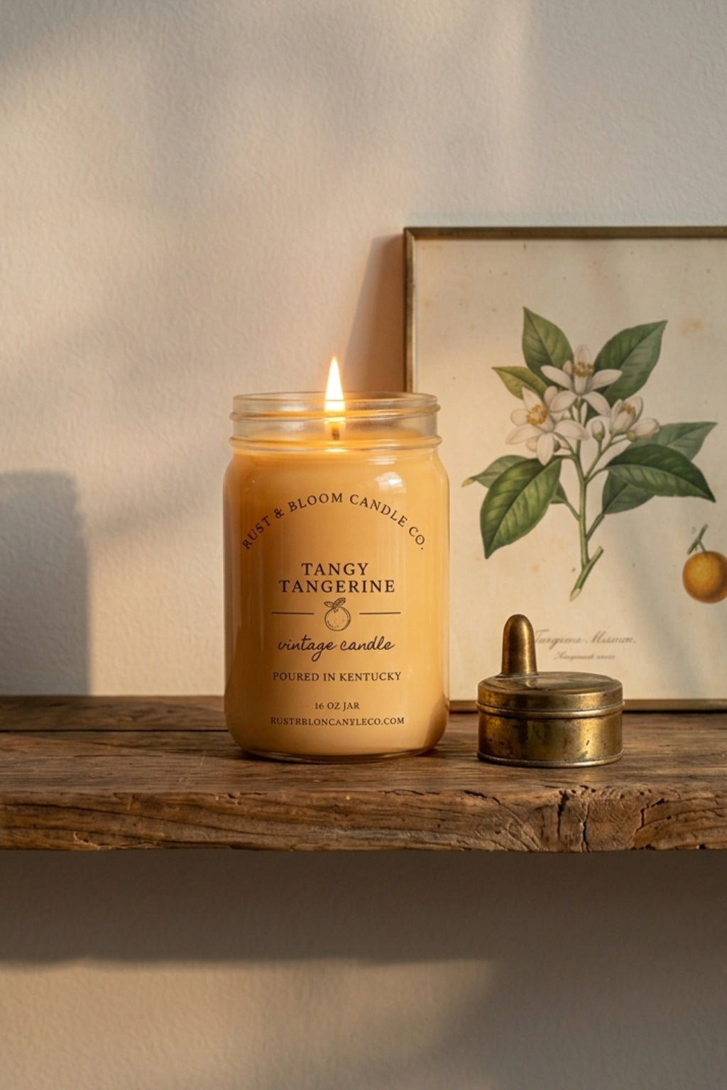 farmhouse citrus candle glowing on table