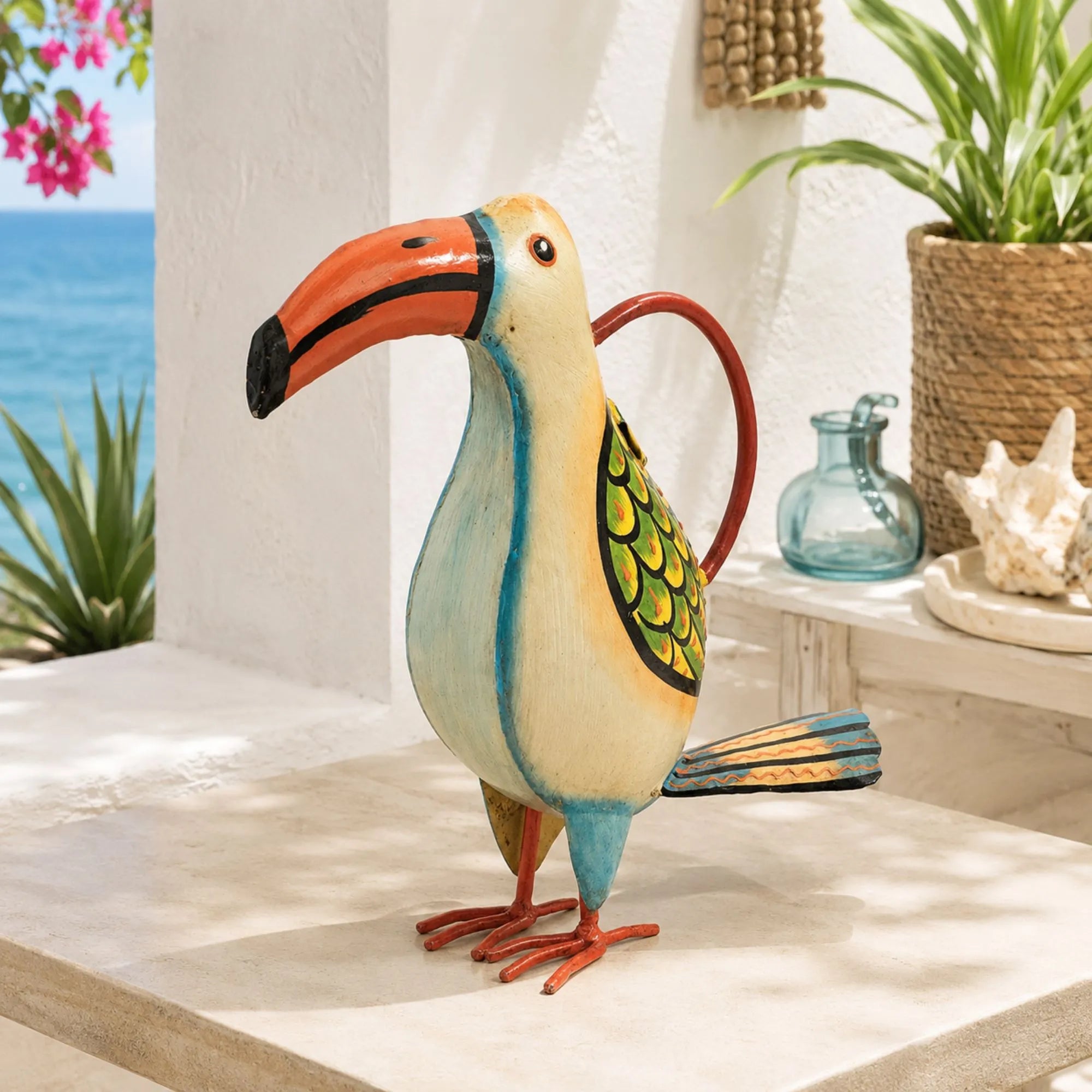 Decorative toucan figurine on a table with a beach view in the background