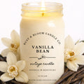 Farmhouse World Vanilla Bean Vintage Candle in a 16 oz jar, surrounded by vanilla beans and orchids. Creamy vanilla scent.