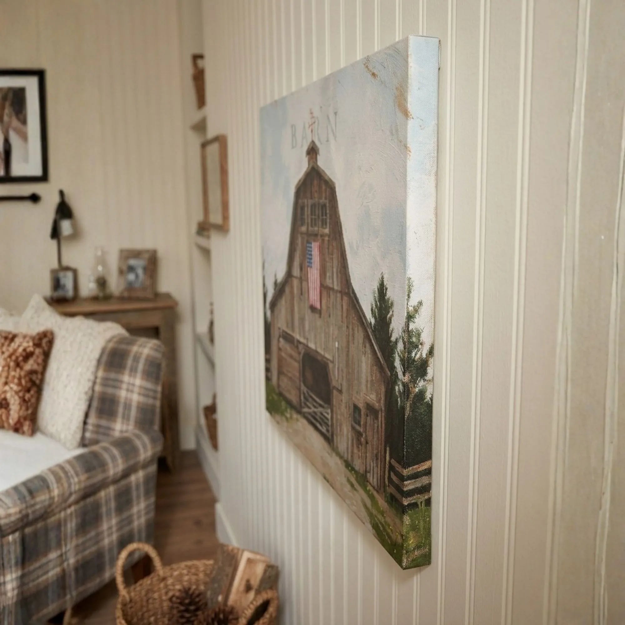 Painting of a wooden cabin on a wall in a living room.