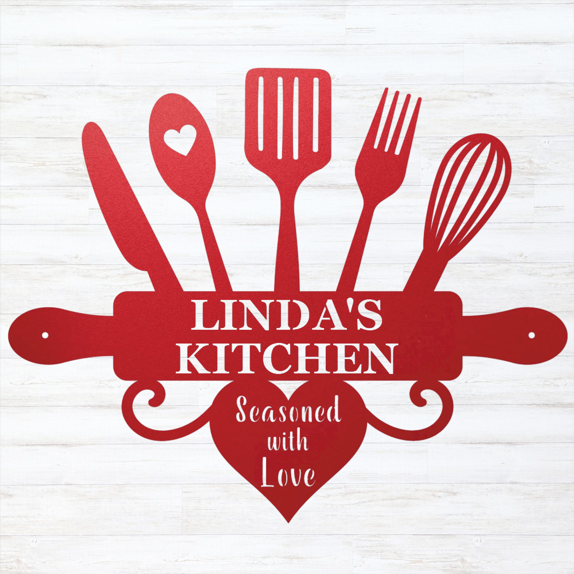A red kitchen-themed decorative sign or cutout featuring utensil silhouettes, a rolling pin, a heart, and the text 'LINDA'S KITCHEN' with 'Seasoned with Love' below, shown on a white wood-plank background.