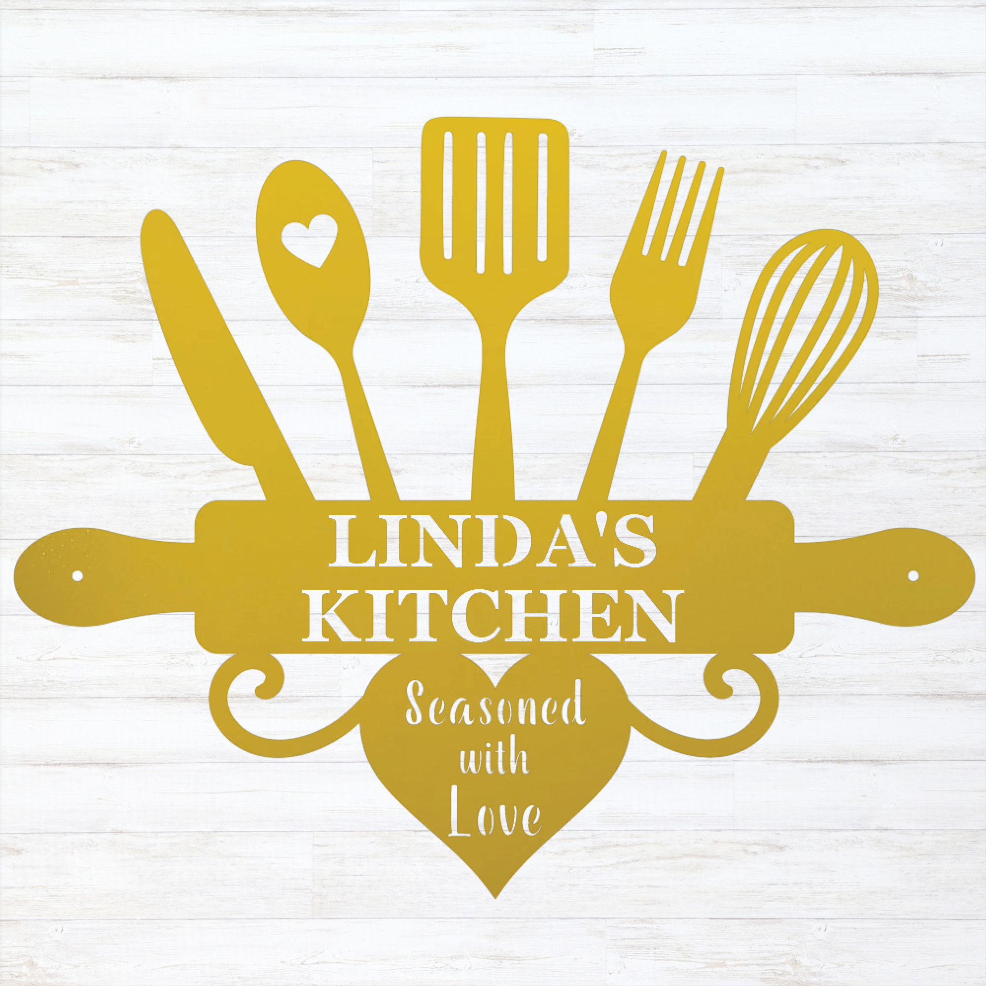 A yellow kitchen-themed decorative sign or silhouette design featuring a knife, spoon with a heart, spatula, fork, whisk, rolling pin, and heart shape with the text 'LINDA'S KITCHEN' and 'Seasoned with Love,' shown on a white wood-plank background.