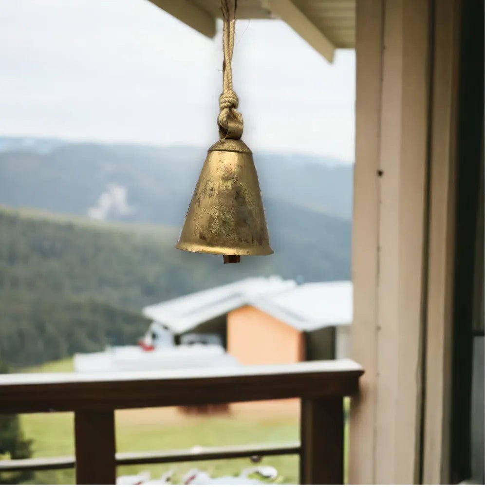 Antique gold cow bell decor with wooden clapper